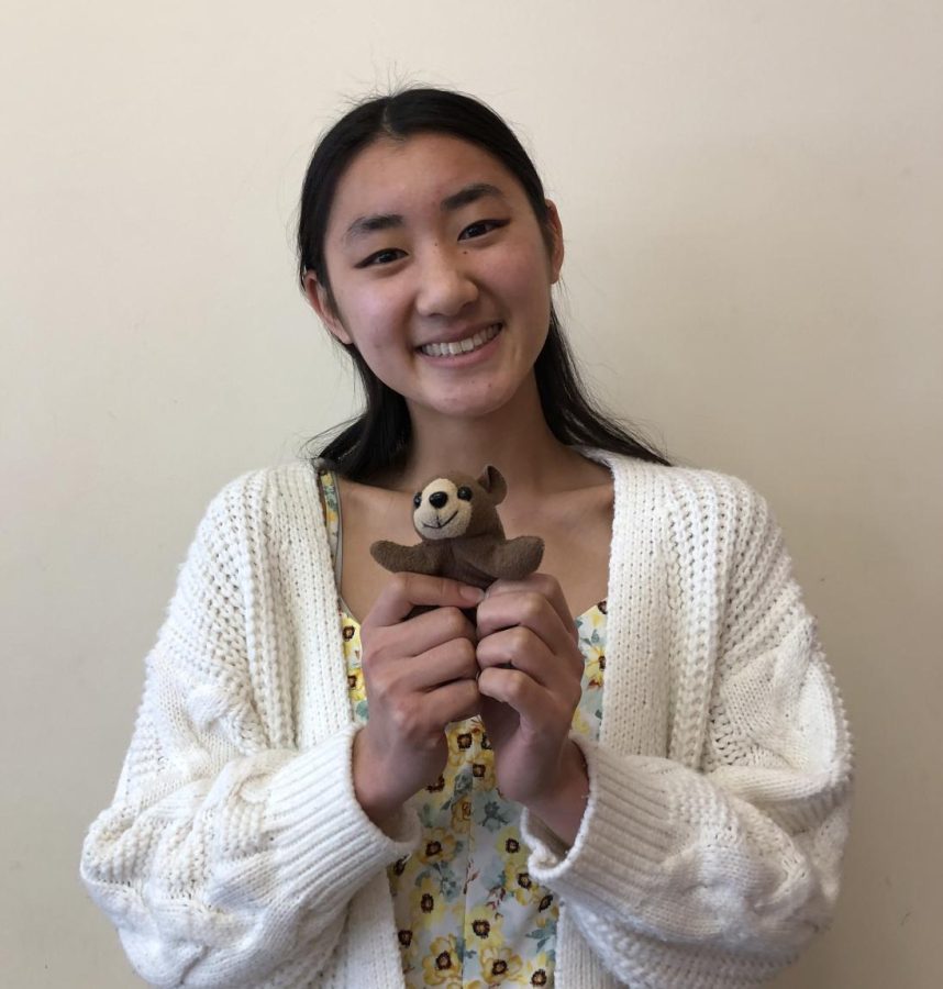 Elimination winner senior Kyra Xue poses with Cocoa, the plushie she used to stay safe during the game. 