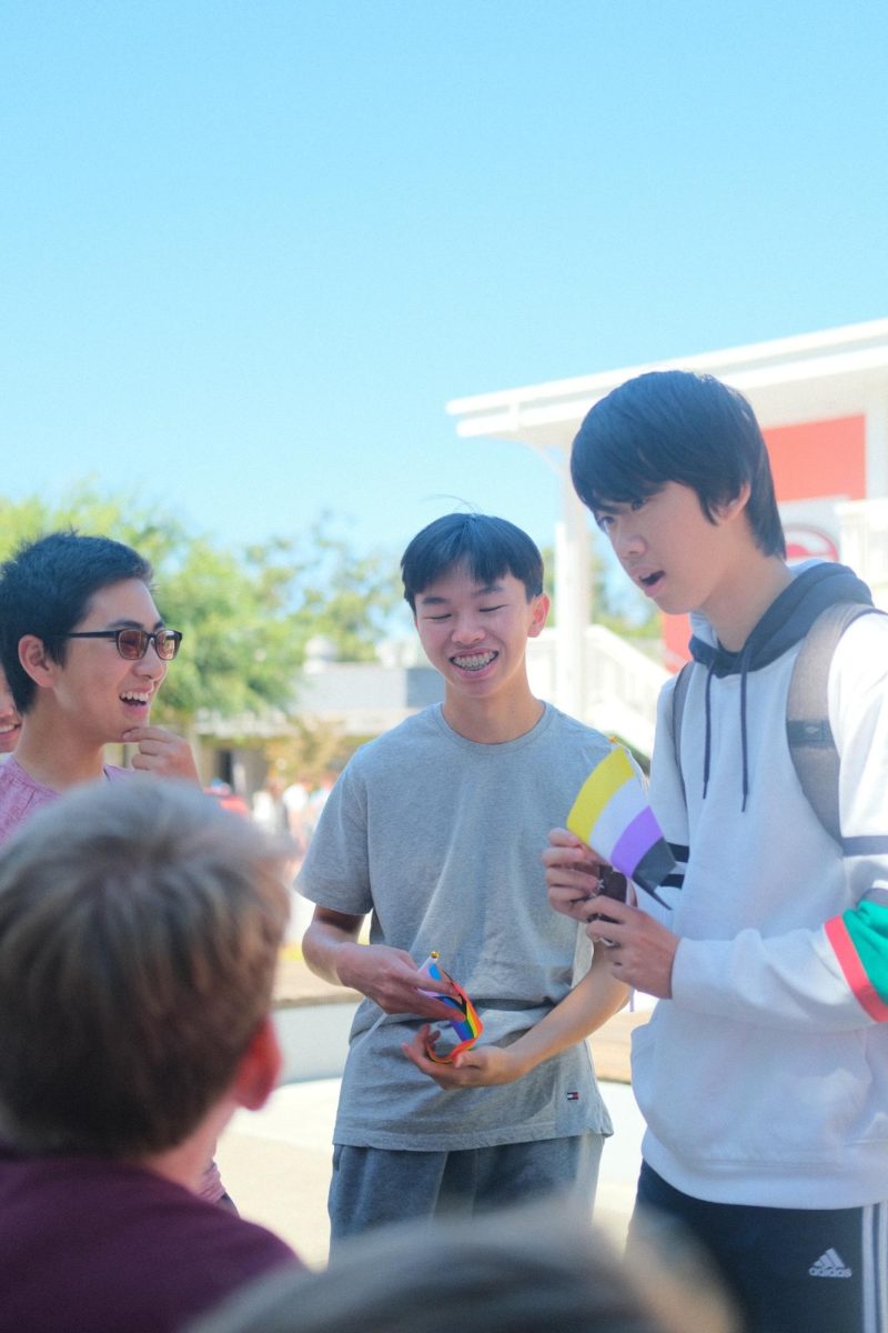 Juniors Jed Ng, Yoonu Park and Kevin Zhang participate in Pride Day activities hosted in the quad on Sept. 12.