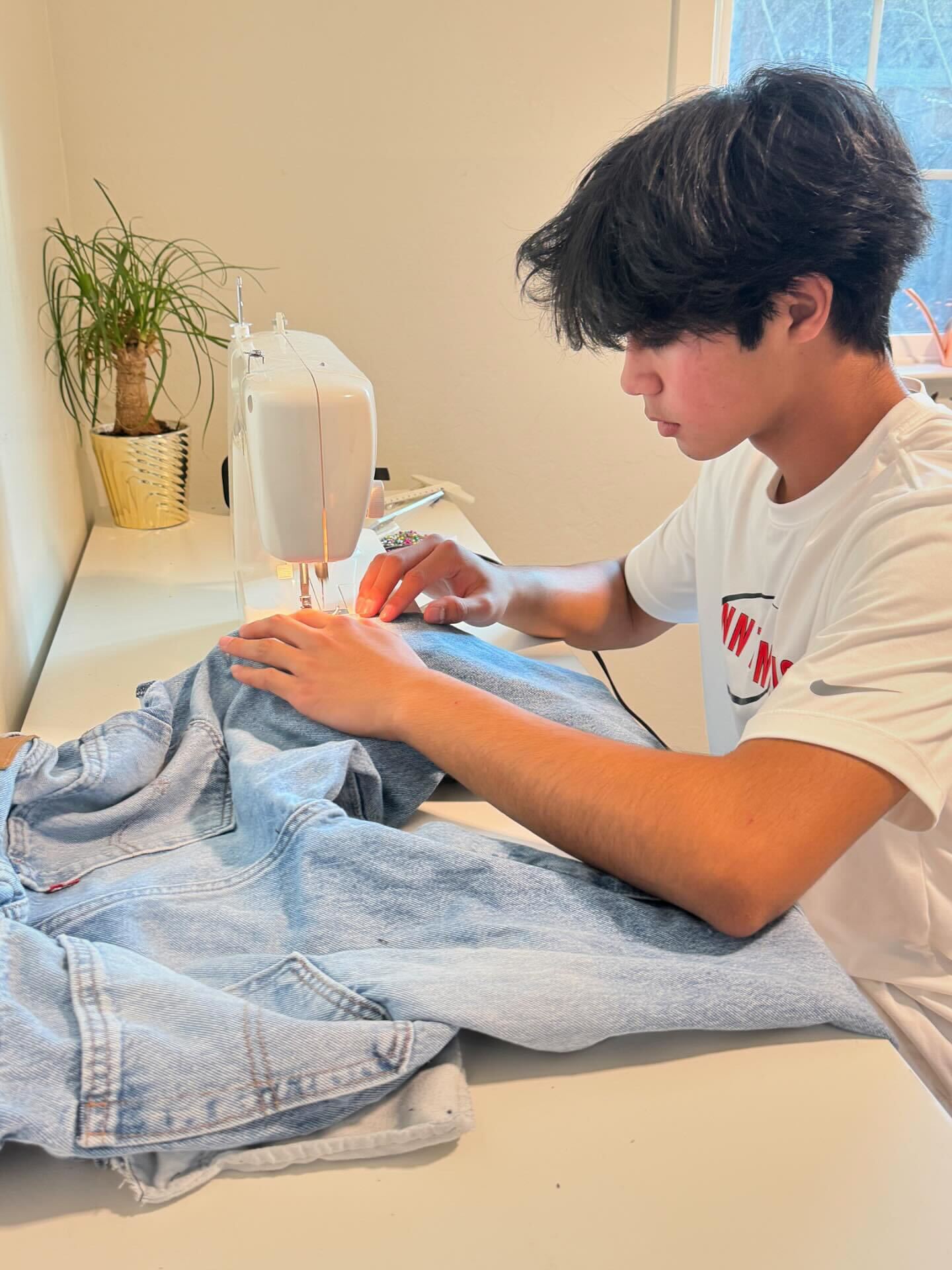 Junior Kamran Khan stitches up tailored garments