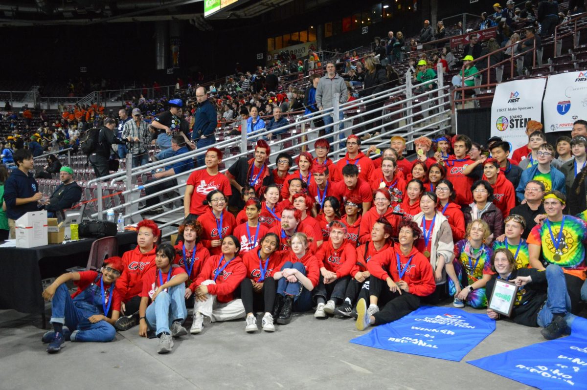 The Gunn Robotics Team poses with their robot after their first-place victory at the Idaho FIRST competition.